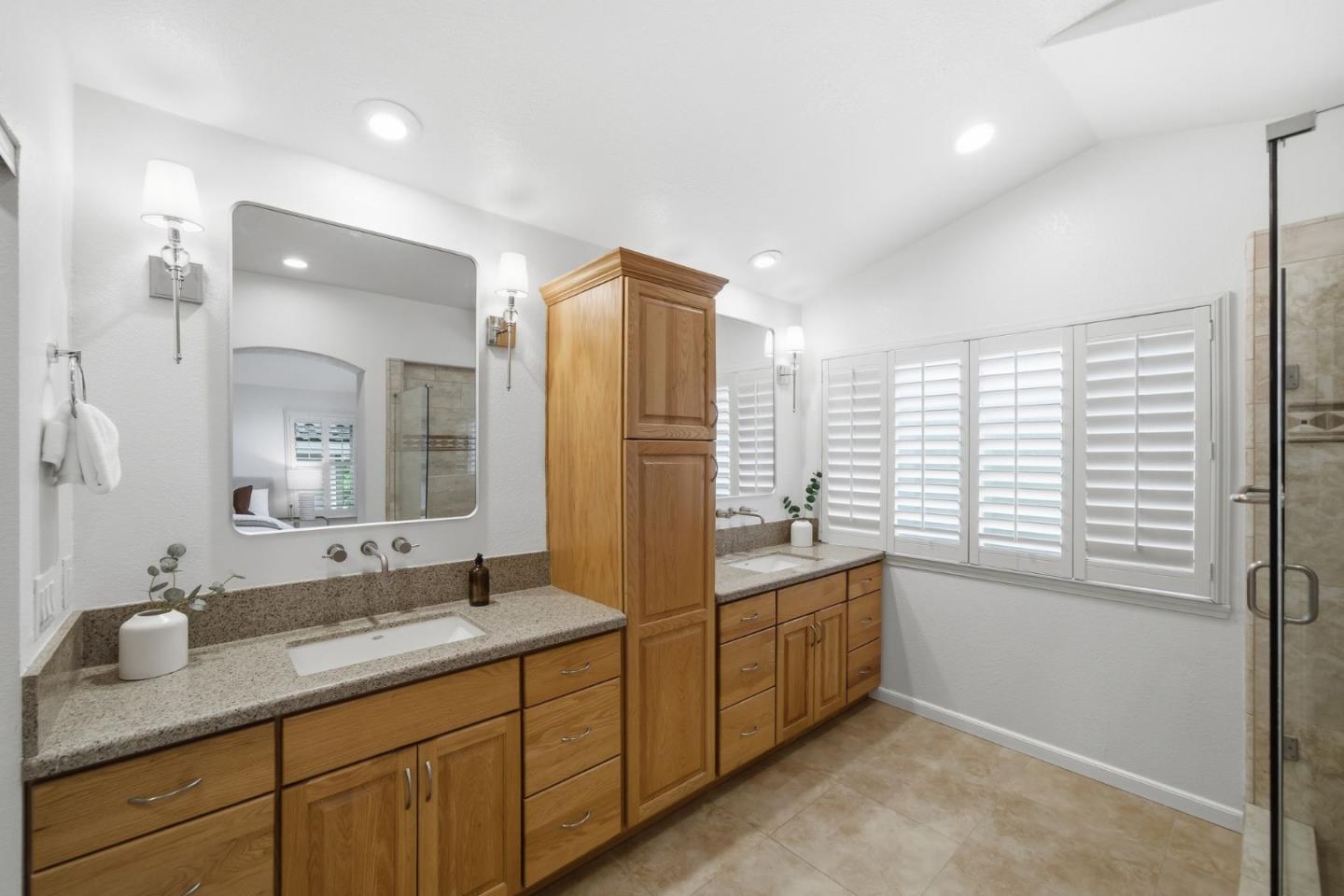 375 Montevideo Circle Fremont, CA 94539 - Photo 26 of 45 a bathroom with a double vanity sink and mirror with shower