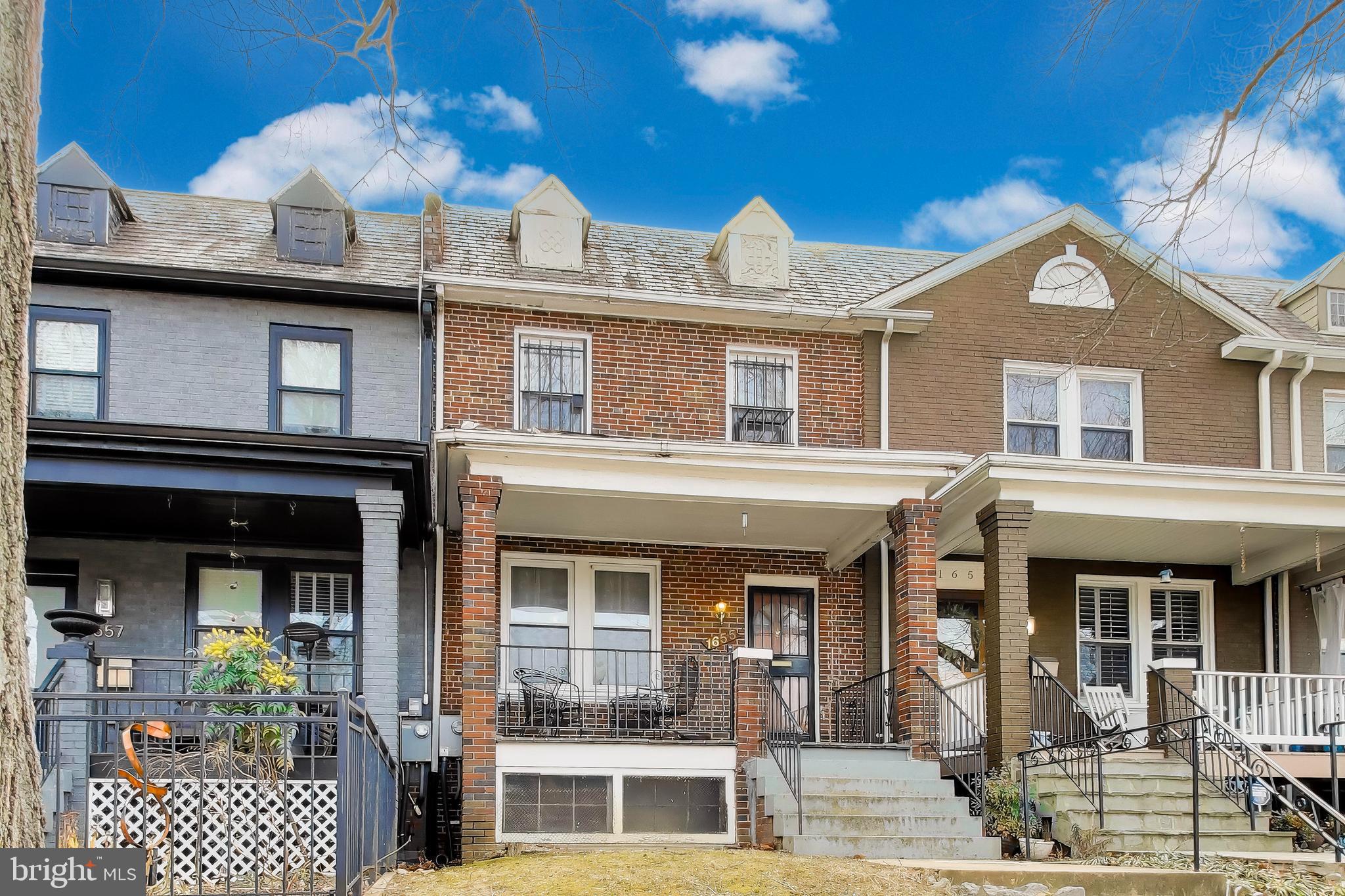 1655 C Street Northeast Washington, DC 20002 - Photo 1 of 18 a front view of a house with a porch