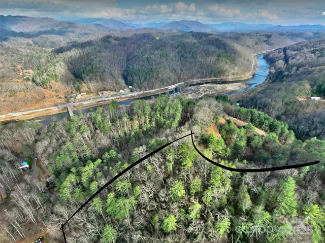 a view of a swimming pool with a yard