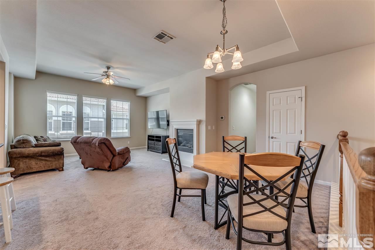 1725 Wind Ranch Road, Unit C Reno, NV 89521 - Photo 3 of 29 a outdoor space with furniture and a chandelier