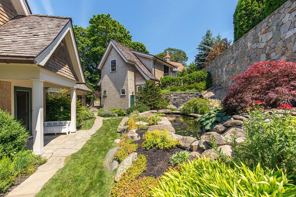 10 Smiths Point Road Manchester, MA 01944 - Photo 20 of 25 a aerial view of a house with a yard and potted plants