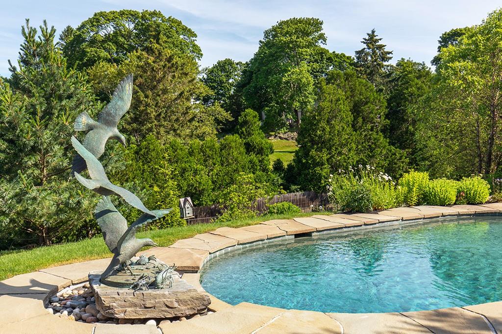 10 Smiths Point Road Manchester, MA 01944 - Photo 23 of 25 a swimming pool with trees in the background