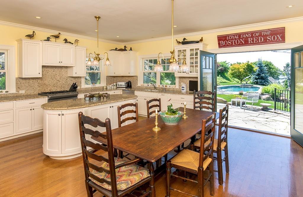 10 Smiths Point Road Manchester, MA 01944 - Photo 7 of 25 a dining room with furniture a large window and kitchen view