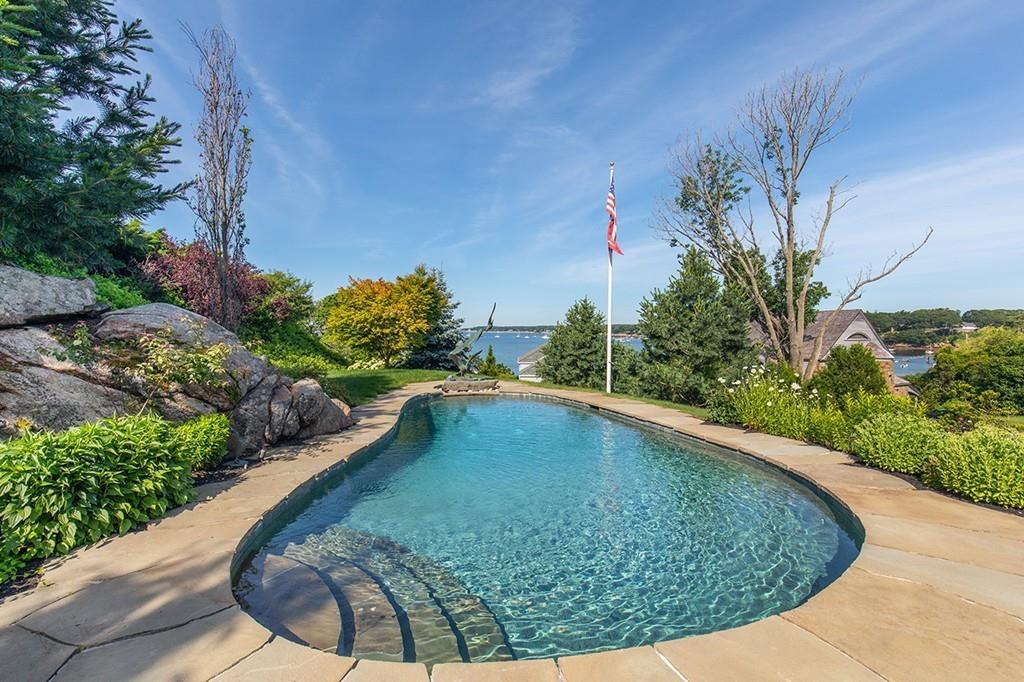 10 Smiths Point Road Manchester, MA 01944 - Photo 9 of 25 a view of a swimming pool with a patio
