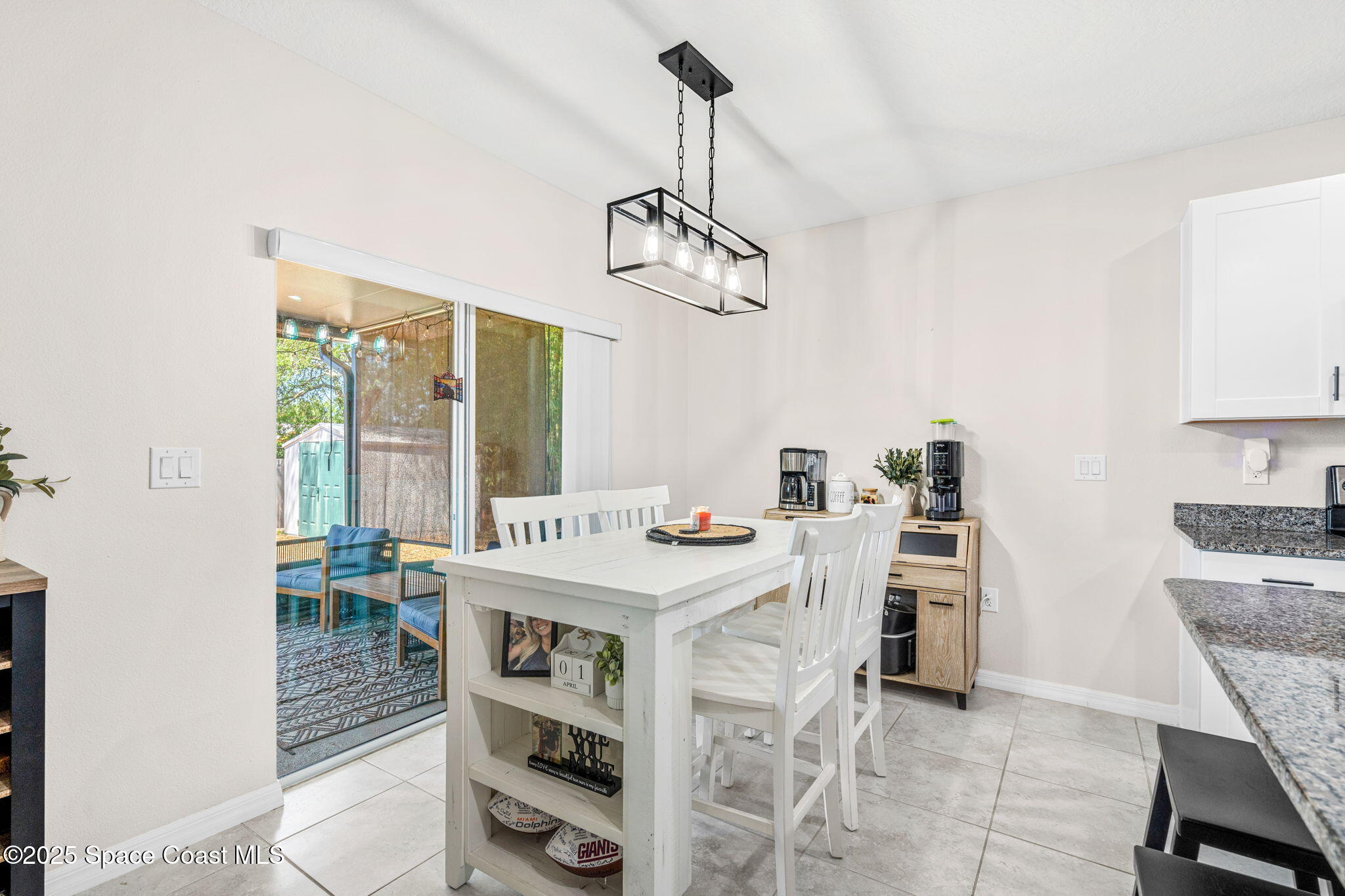 6162 Rena Avenue Cocoa, FL 32927 - Photo 13 of 42 a view of a dining room with furniture window and outside view