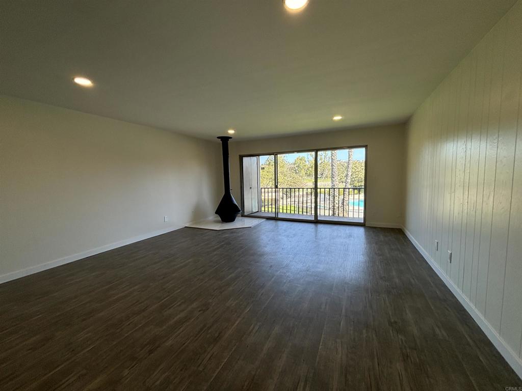 4201 Bonita Road, Unit 242 Bonita, CA 91902 - Photo 2 of 11 an empty room with wooden floor and windows