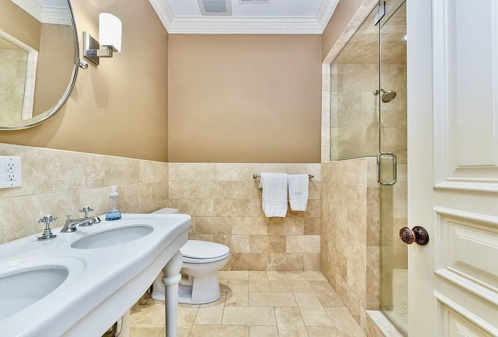 61 M Street, Unit 1 Boston, MA 02127 - Photo 14 of 15 a bathroom with a sink toilet and shower