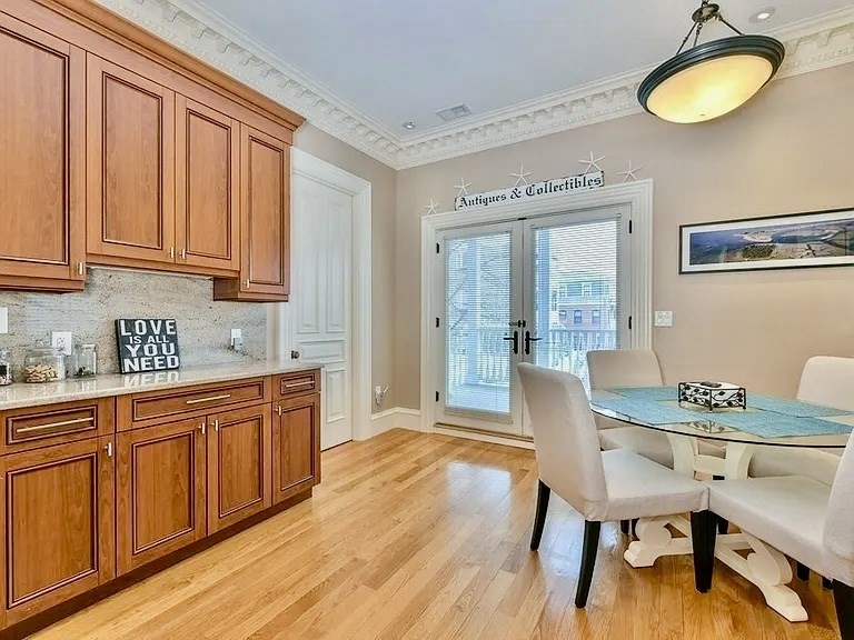 61 M Street, Unit 1 Boston, MA 02127 - Photo 4 of 15 a view of a dining room with furniture and wooden floor