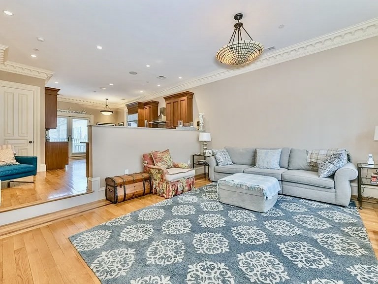 61 M Street, Unit 1 Boston, MA 02127 - Photo 6 of 15 a living room with furniture and a chandelier