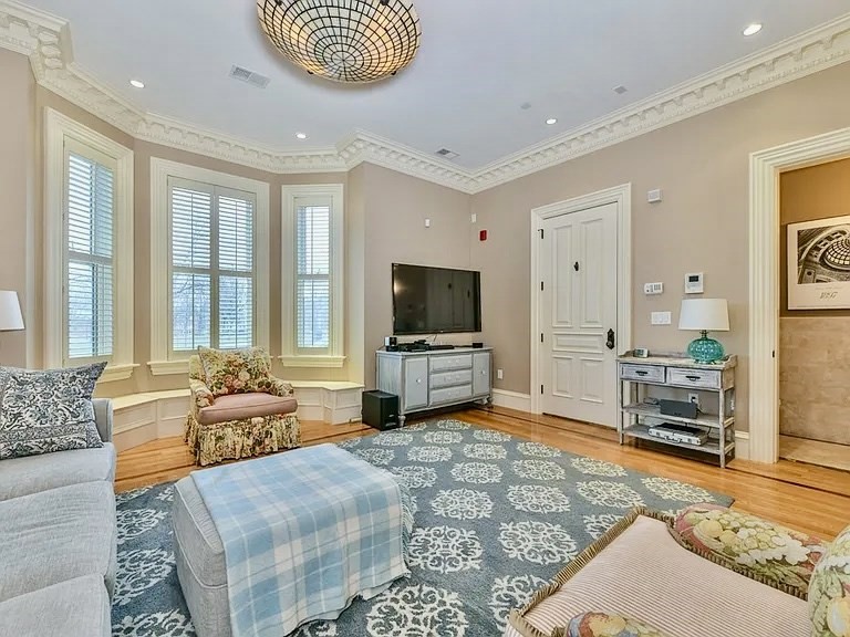 61 M Street, Unit 1 Boston, MA 02127 - Photo 7 of 15 a living room with furniture and a flat screen tv
