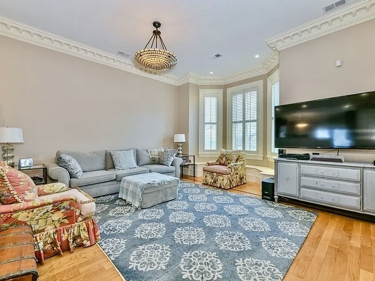 61 M Street, Unit 1 Boston, MA 02127 - Photo 8 of 15 a living room with furniture and a flat screen tv
