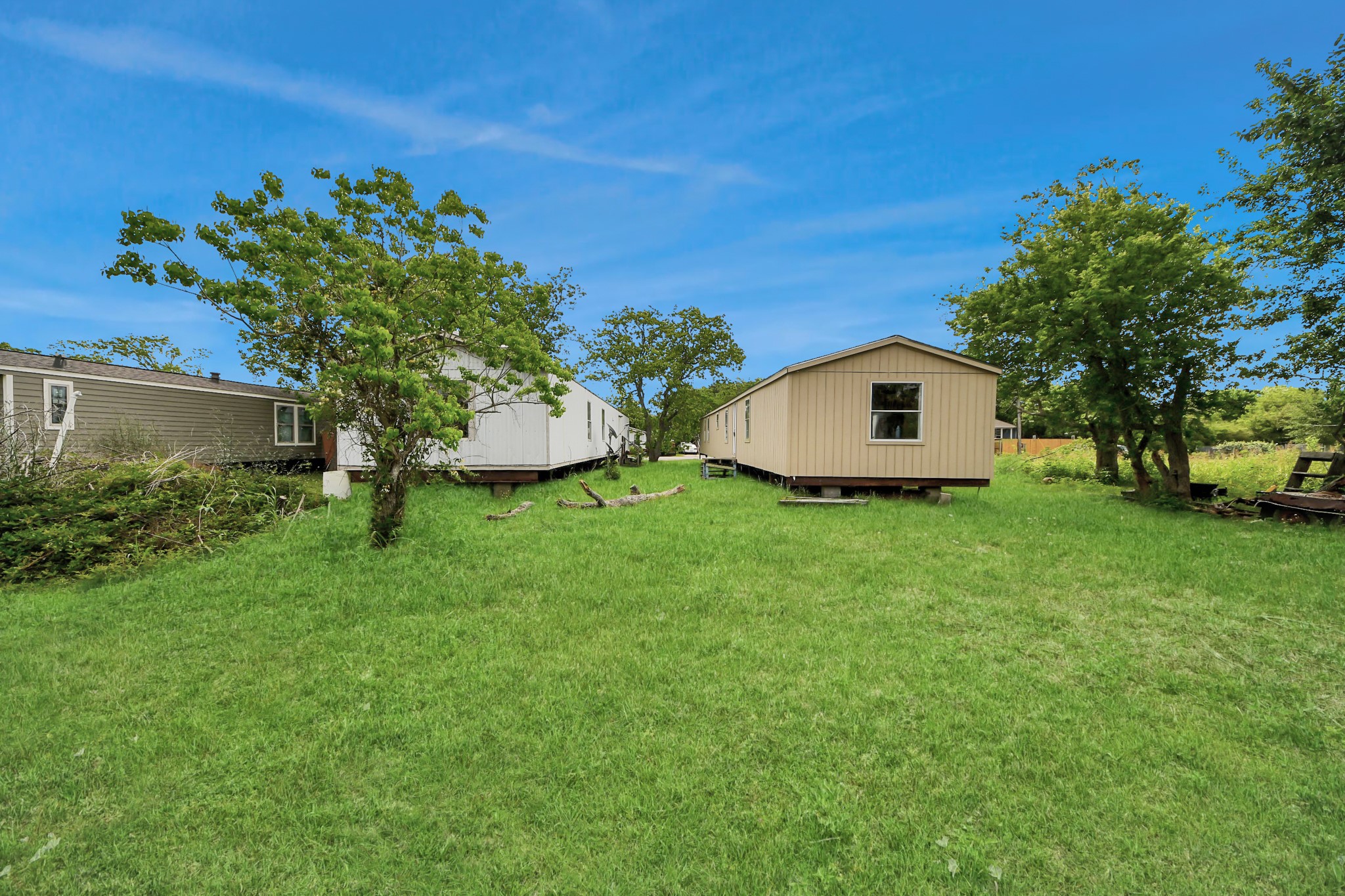 320 4th Street San Leon, TX 77539 - Photo 21 of 29 a view of a backyard with potted plants and large trees