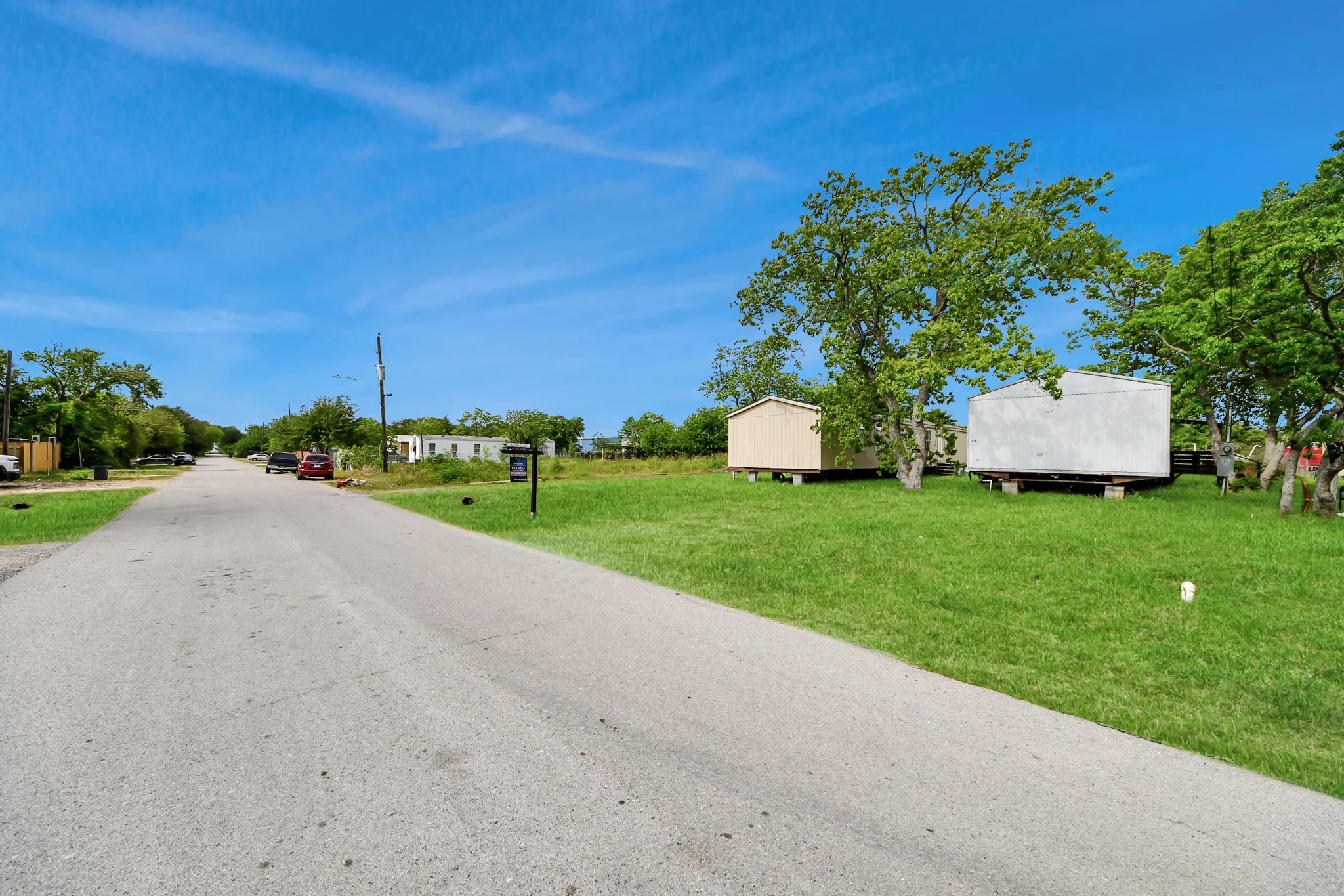 320 4th Street San Leon, TX 77539 - Photo 26 of 29 a view of a house with a big yard and large trees