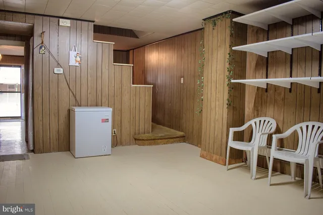 a view of a room with window and hardwood floor