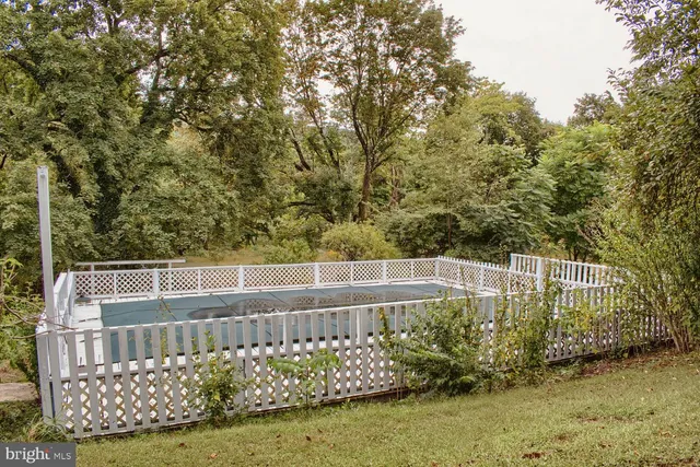 a view of a roof deck with wooden fence