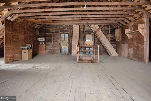 a bed room with a bed and a window