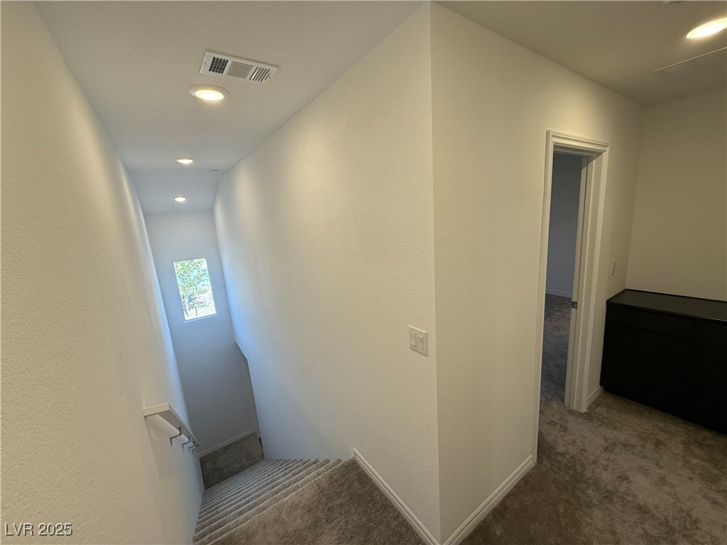 10774 Astell Isle Court Las Vegas, NV 89166 - Photo 12 of 34 Staircase with carpet flooring, recessed lighting, and a textured wall