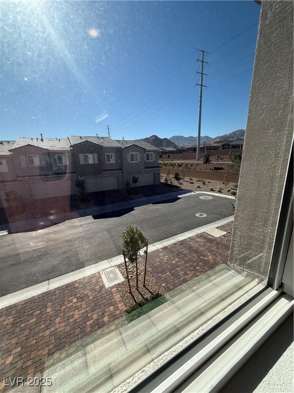 10774 Astell Isle Court Las Vegas, NV 89166 - Photo 29 of 34 View of asphalt street featuring a mountain view, sidewalks, and a residential view