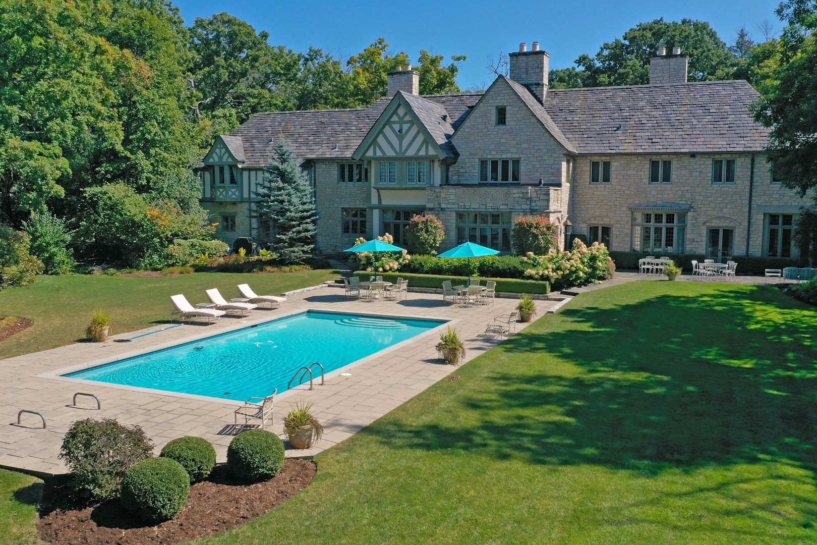 1650 Green Bay Road Lake Bluff, IL 60044 - Photo 1 of 63 a front view of a house with garden
