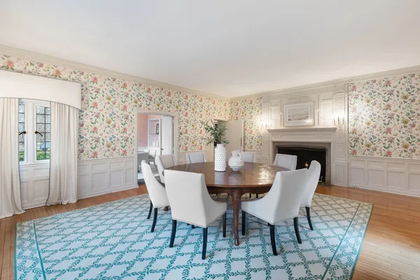 a living room with furniture wooden floor and a window