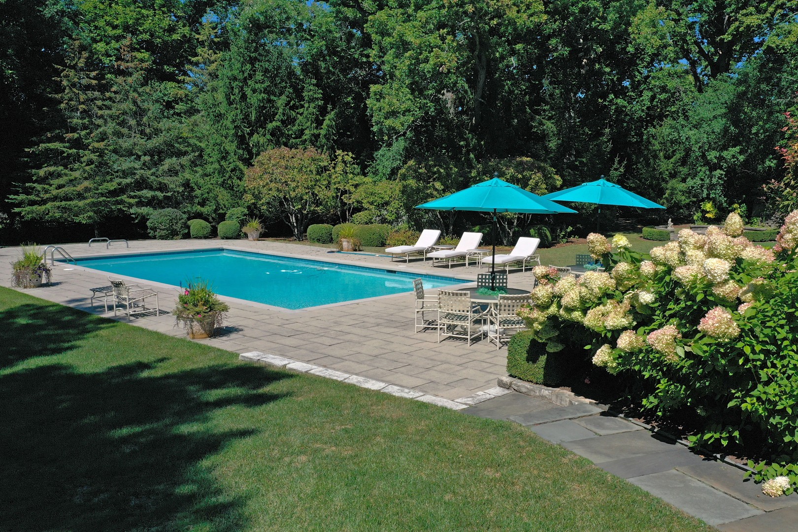 1650 Green Bay Road Lake Bluff, IL 60044 - Photo 47 of 63 a view of a patio with furniture and a garden