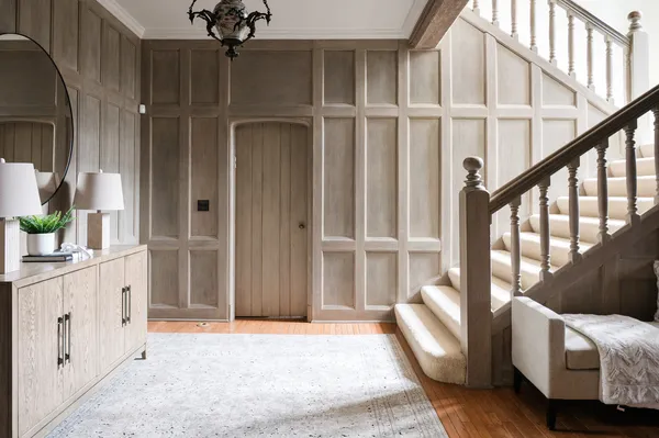 a living room with furniture and two windows