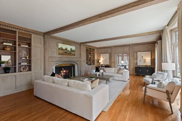 a living room with furniture and a potted plant