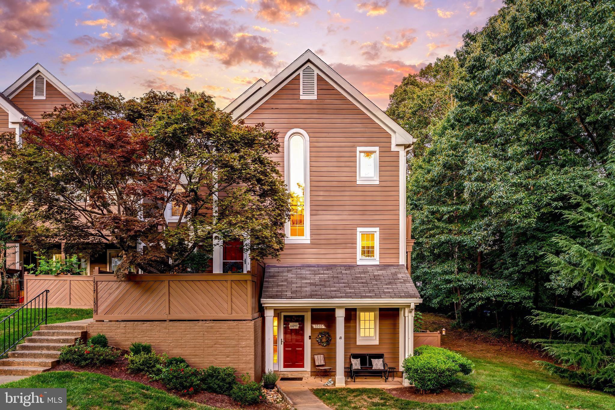 1519 Church Hill Place Reston, VA 20194 - Photo 2 of 14 a front view of a house with a yard and garage