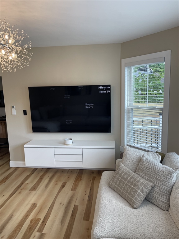 35 Riverview Drive Gill, MA 01354 - Photo 18 of 25 a living room with a couch and a floor to ceiling window