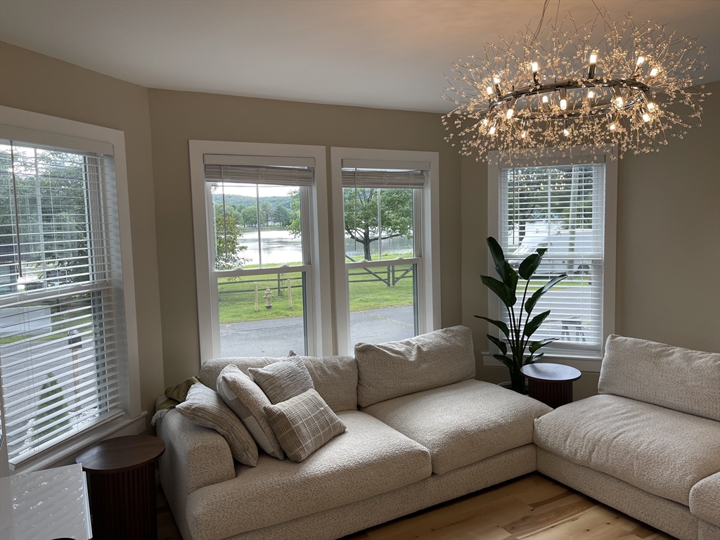 35 Riverview Drive Gill, MA 01354 - Photo 19 of 25 a living room with furniture and a large window