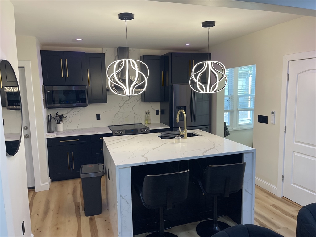 35 Riverview Drive Gill, MA 01354 - Photo 20 of 25 a kitchen with a sink and a refrigerator