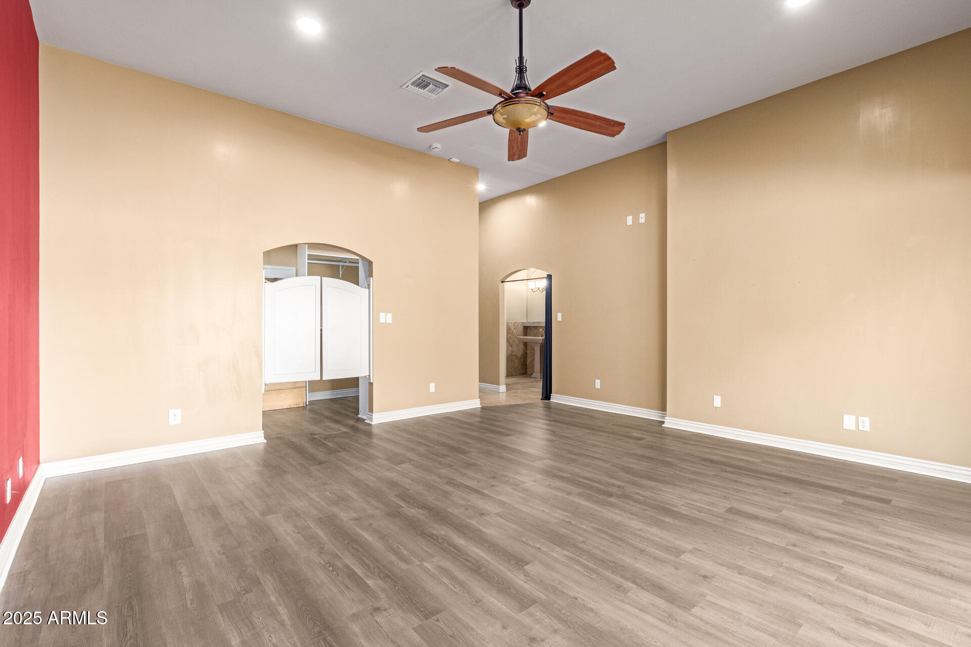 622 West Linger Lane Phoenix, AZ 85021 - Photo 14 of 26 a view of an empty room with a window and wooden floor