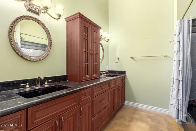 a bathroom with a sink a mirror and a toilet