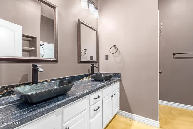 a bathroom with sink and mirror