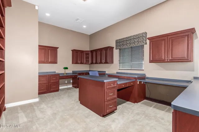 a room with furniture cabinets and window