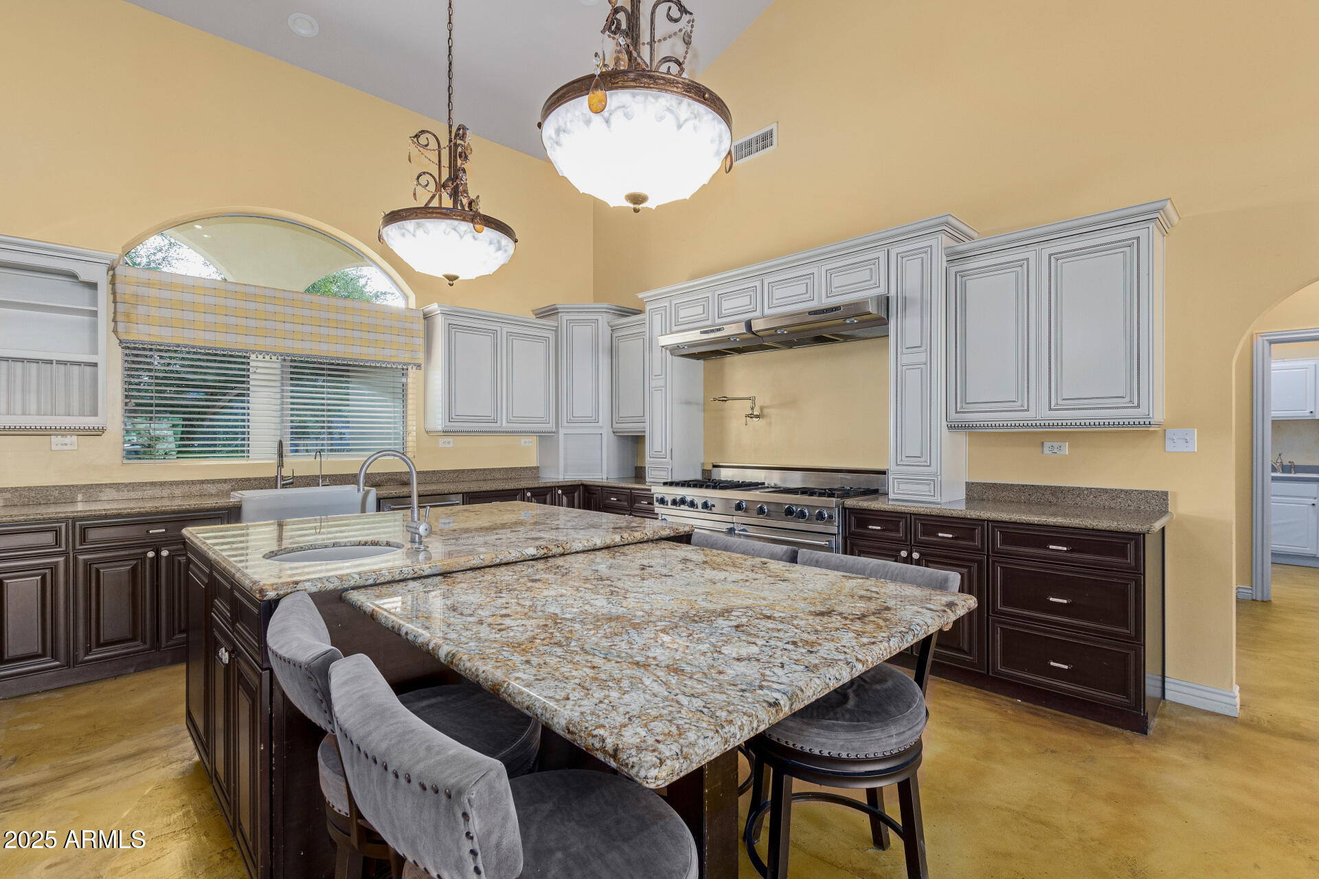 622 West Linger Lane Phoenix, AZ 85021 - Photo 7 of 26 a dining table with chairs and cabinets