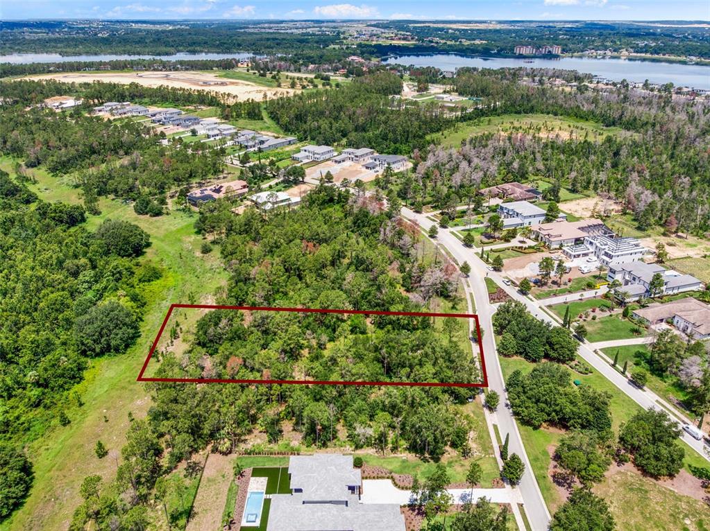 16901 Crete Way Bella Collina, FL 34756 - Photo 4 of 12 an aerial view of residential houses with outdoor space and trees