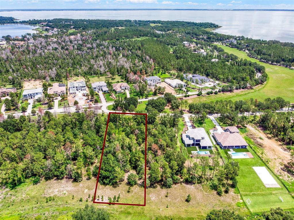 16901 Crete Way Bella Collina, FL 34756 - Photo 6 of 12 an aerial view of residential houses with outdoor space and trees