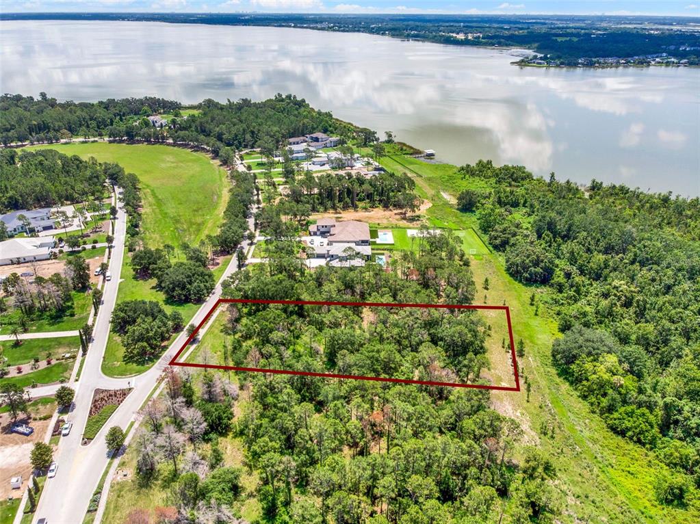 16901 Crete Way Bella Collina, FL 34756 - Photo 7 of 12 a view of a lake with a city view