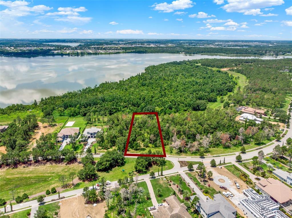 16901 Crete Way Bella Collina, FL 34756 - Photo 10 of 12 a view of a lake with a big yard