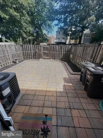 a view of a backyard with sitting area