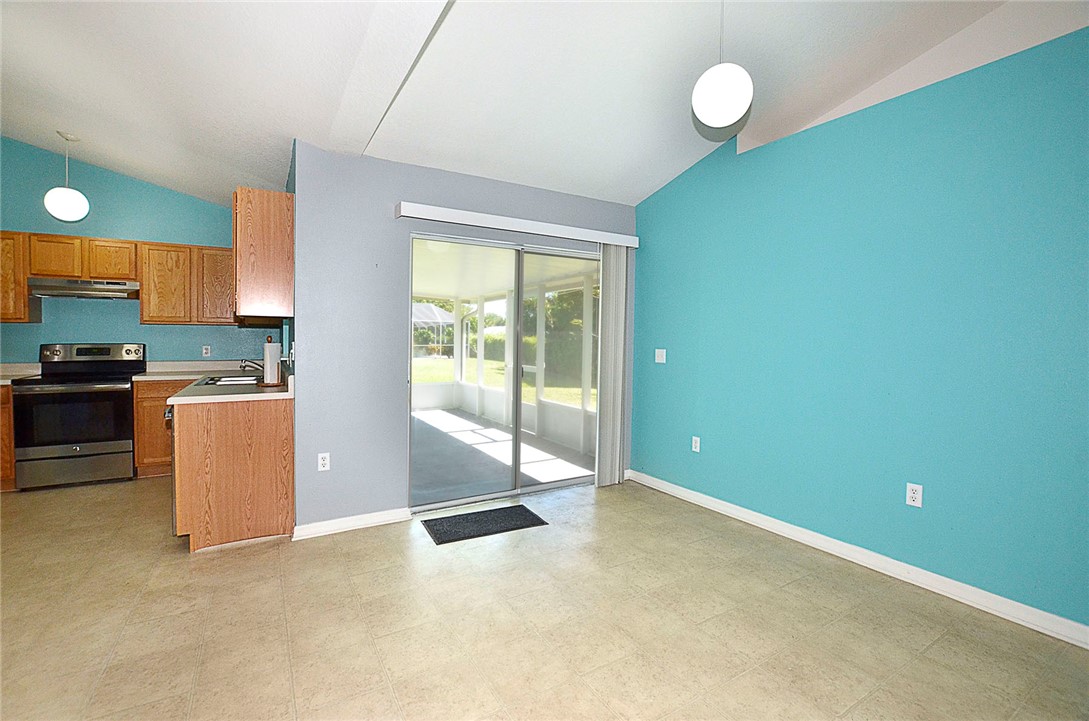 649 Chesser Avenue Sebastian, FL 32958 - Photo 15 of 36 a view of a kitchen with a sink cabinets and a window