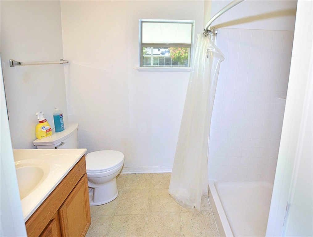 649 Chesser Avenue Sebastian, FL 32958 - Photo 19 of 36 a white toilet sitting next to a bath tub