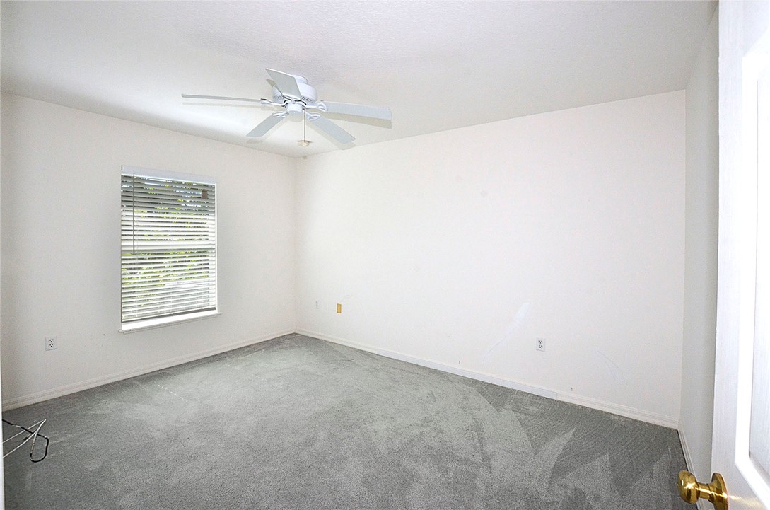 649 Chesser Avenue Sebastian, FL 32958 - Photo 25 of 36 an empty room with a window and a fan
