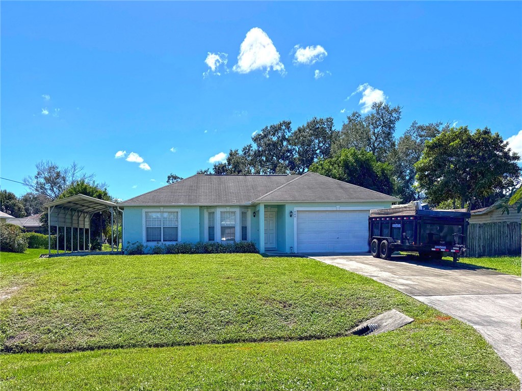 649 Chesser Avenue Sebastian, FL 32958 - Photo 3 of 36 a view of a house with a yard porch and sitting area