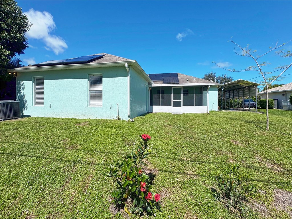 649 Chesser Avenue Sebastian, FL 32958 - Photo 34 of 36 a front view of a house with garden