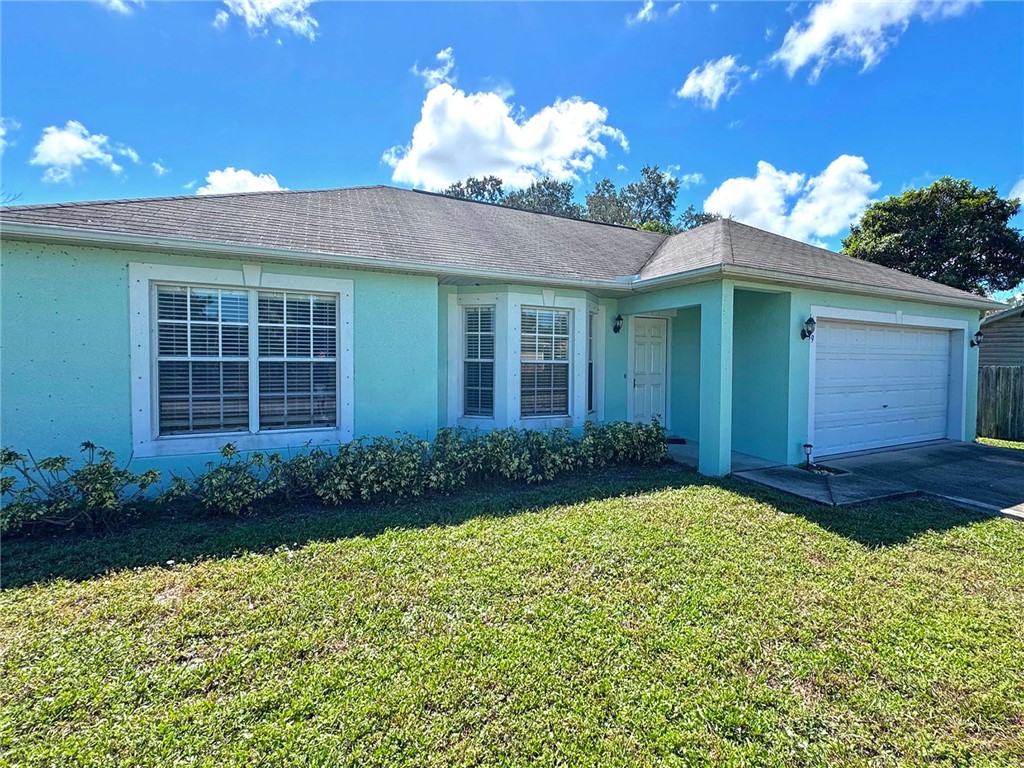 649 Chesser Avenue Sebastian, FL 32958 - Photo 4 of 36 a view of a house with a garden