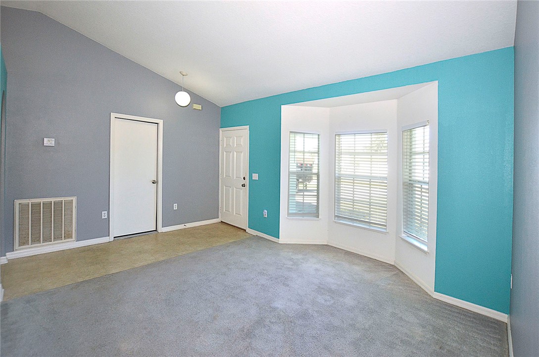 649 Chesser Avenue Sebastian, FL 32958 - Photo 8 of 36 an empty room with windows