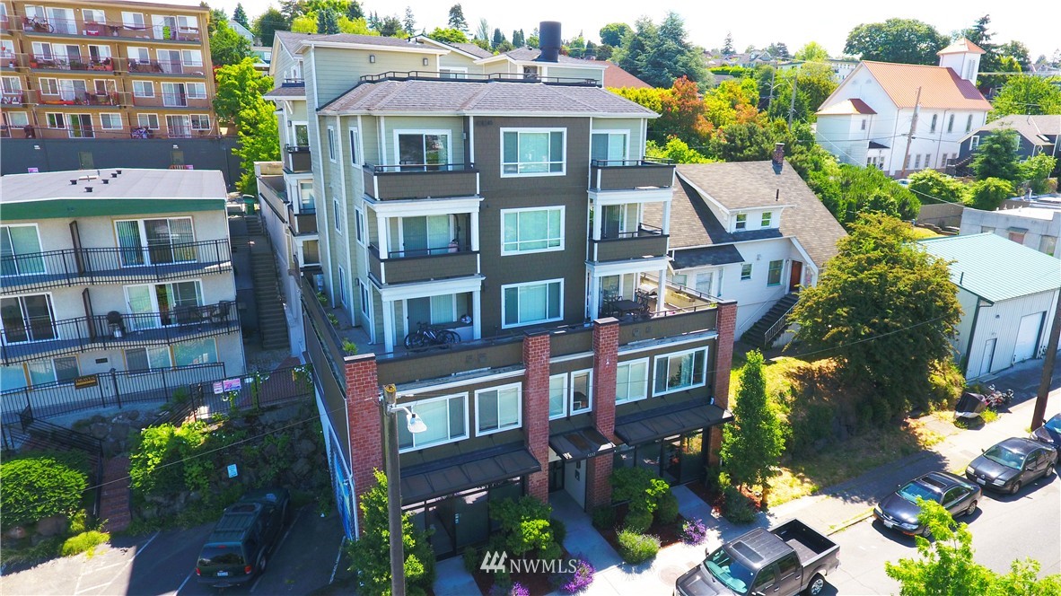 a front view of a residential apartment building with a yard