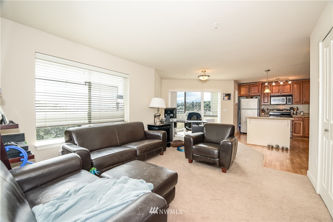 3232 15th Avenue West Seattle, WA 98119 - Photo 13 of 18 a living room with furniture and a large window